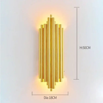 Modern gold wall lamp with golden brass vertical cylindrical rods in a symmetrical pattern for decorbites crystal wall lamp