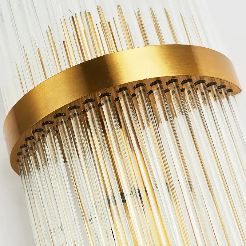Modern gold toned wall lamp with clear glass rods cascading downward perfect for decorbites crystal wall decor