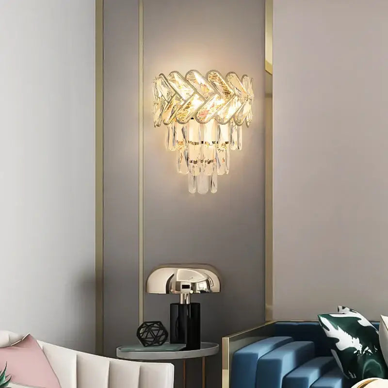 Modern gold and silver decorbites crystal wall sconce with stainless steel frame and cascading clear glass prisms