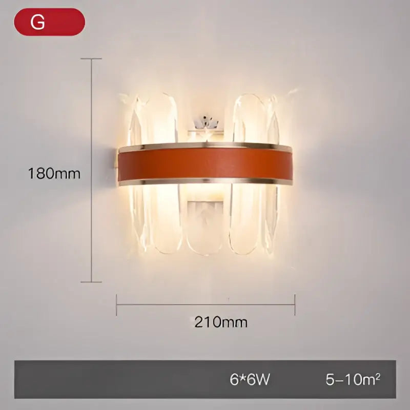 Modern wall sconce featuring clear crystal prisms and an orange-brown stainless steel band for decorbites crystal gold lighting