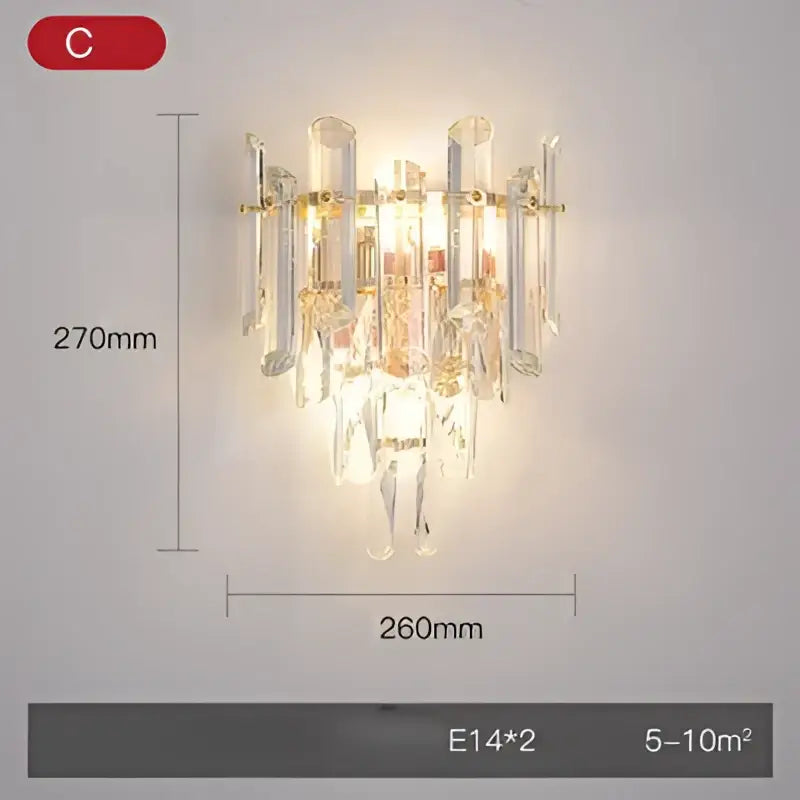 Modern gold and silver crystal wall sconce with clear glass tubes and dangling droplets in stainless steel decorbites crystal gold