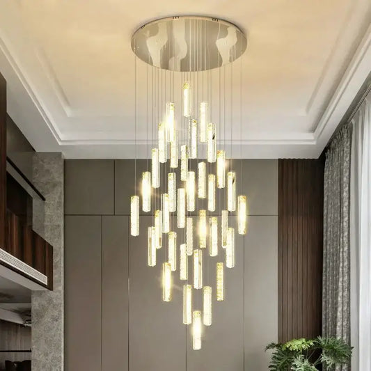 Modern gold and silver decorbites crystal chandelier with circular metallic base and cascading glass rods for dining room light