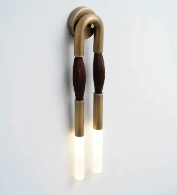 Brass wall lamp with dark brown textured accents and frosted glass light diffusers from decorbites designer tassel collection
