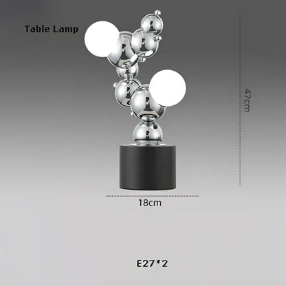 Silver metallic table lamp with modern abstract design and black base for decorbites dimmable led pendant light use