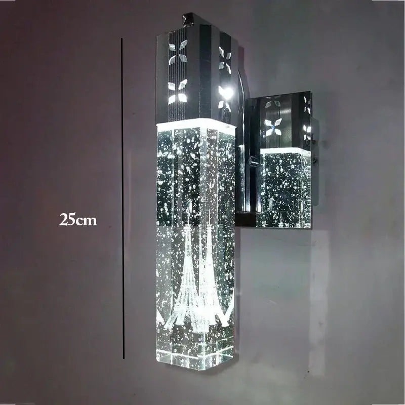 A modern chrome and acrylic wall sconce with illuminated eiffel tower design for bubble crystal led pendant lights