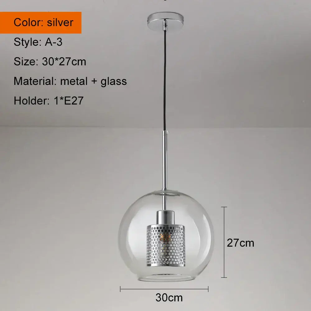 Modern gold and silver honeycomb glass pendant light featuring a silver spherical ball glass pendant with perforated shade