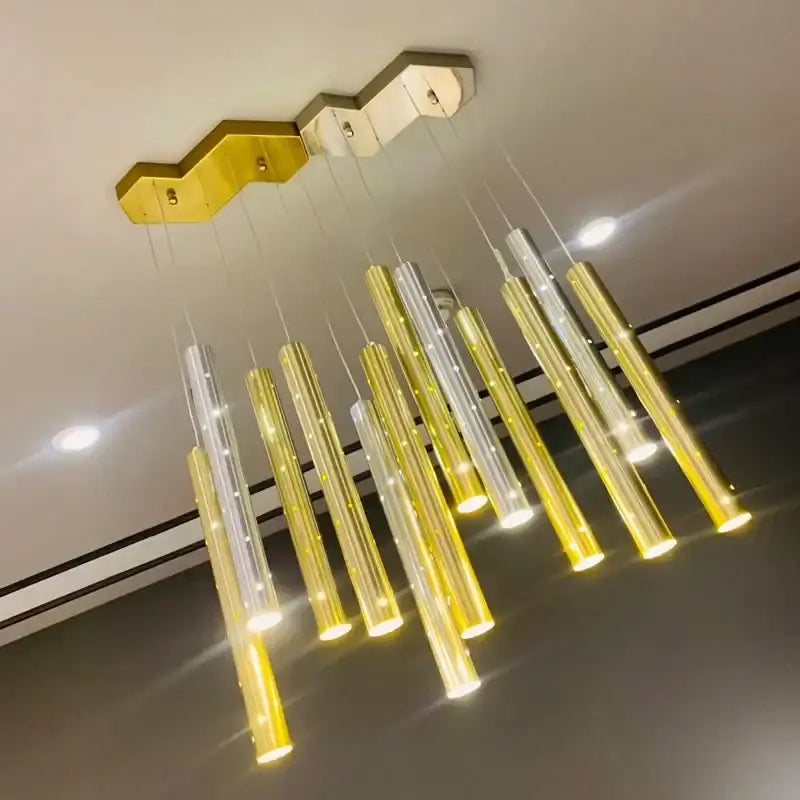 Modern gold silver led pendant light with cylindrical glass tubes and hexagonal brass mount for dining room decorbites gold silver
