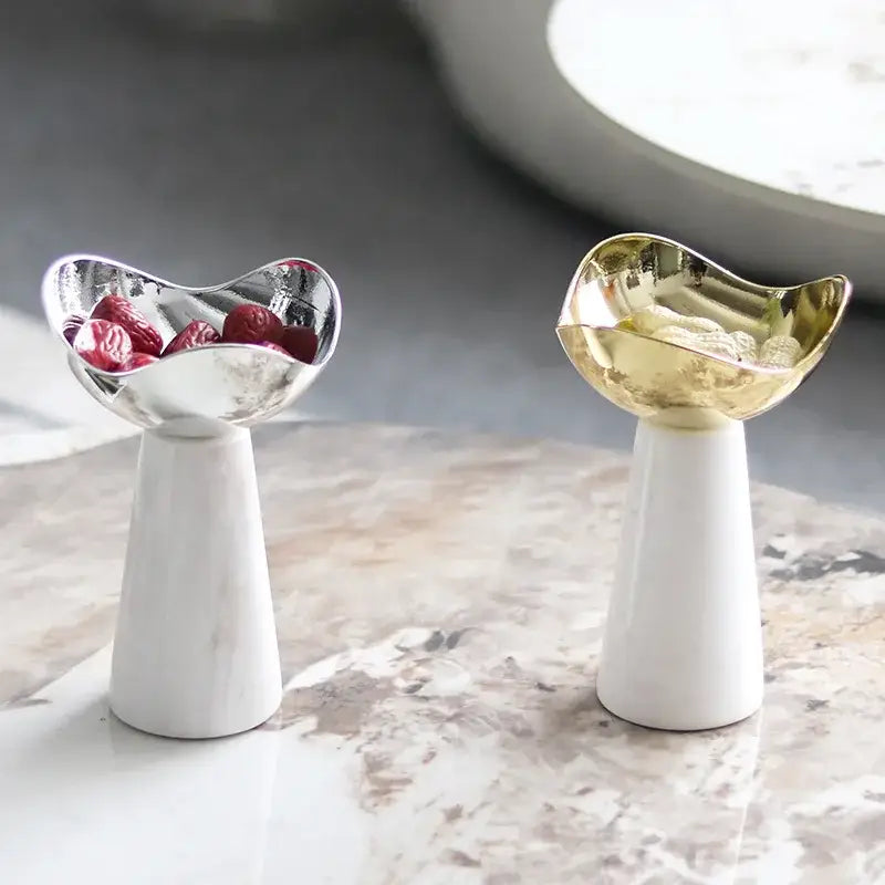 Modern gold and silver dessert bowl with sleek metallic finish and white marble base by decorbites golden tray
