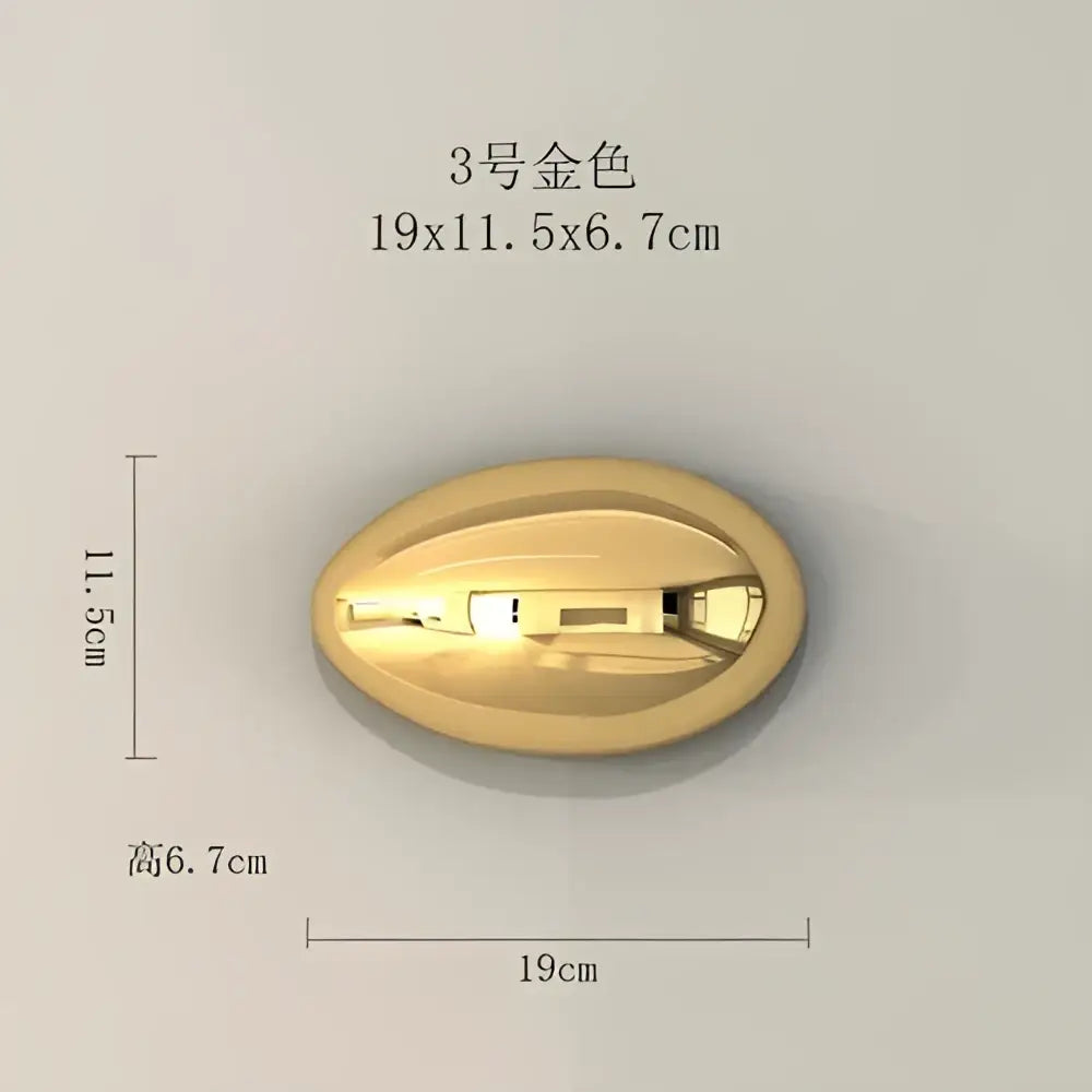 Modern gold and silver metallic oval button with engraved details used as wall hanging ornaments for living room