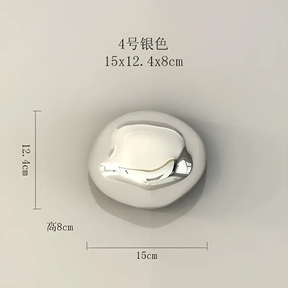 A sleek silver metallic button with a smooth oval shape used in modern gold and silver wall hanging ornaments