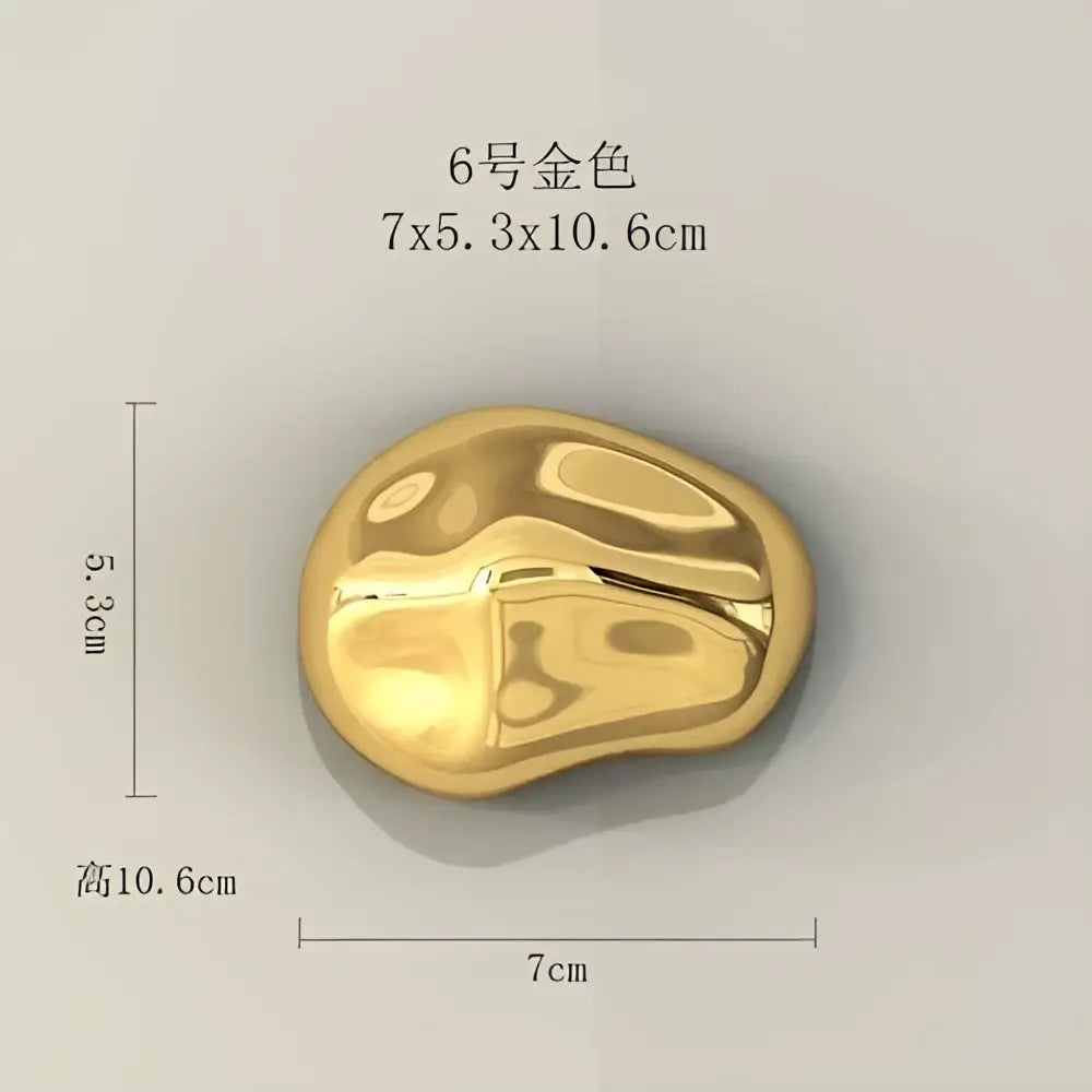 Modern gold metallic rock wall hanging ornament with smooth polished finish for living room decor