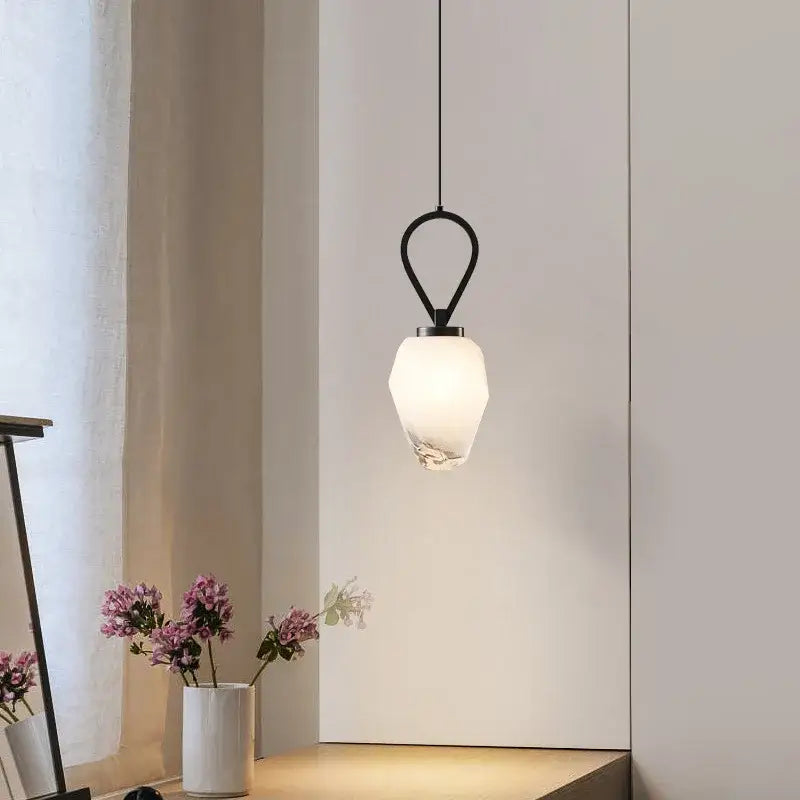 Modern gold skull sculpture decorbites adjustable brass kitchen decor with a minimalist black metal pendant light and frosted glass shade