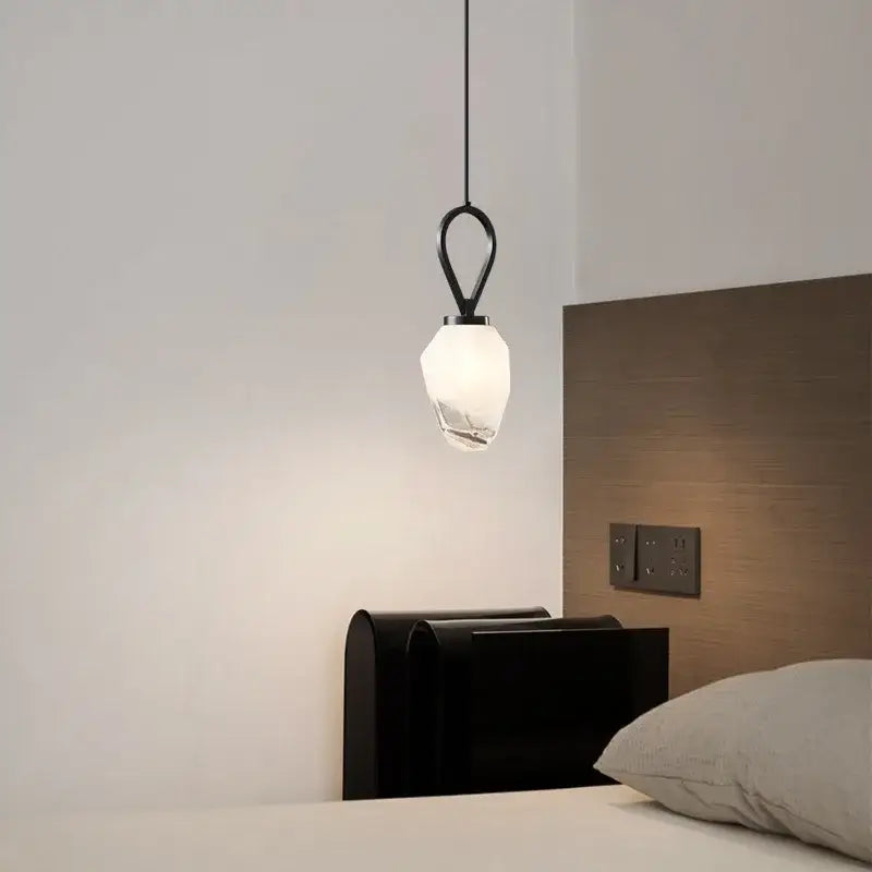 Black metal pendant light with faceted white glass shade featured in decorbites adjustable brass kitchen decor