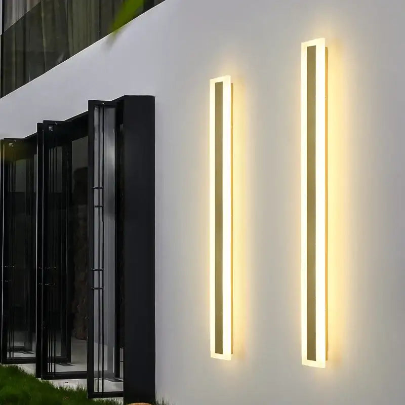 Two modern gold slim led wall lamps with minimalist rectangular design and warm light for outdoor decorbites led wall use