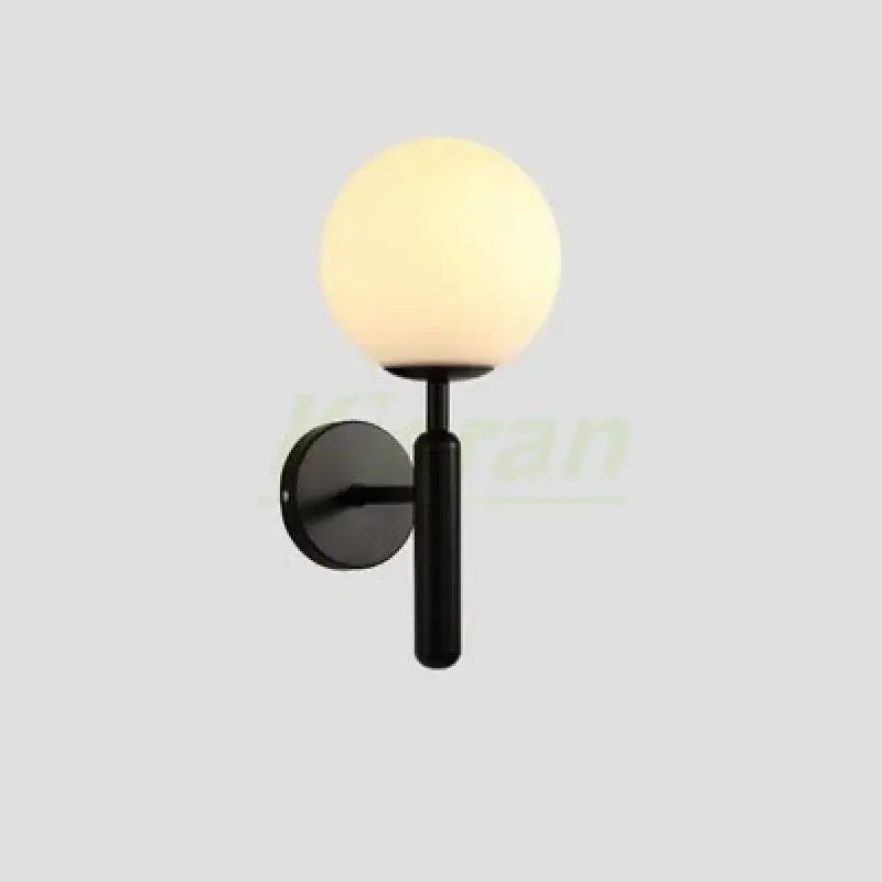 Black modern wall sconce with frosted glass globe shade featuring led wall lamps design for bedroom use