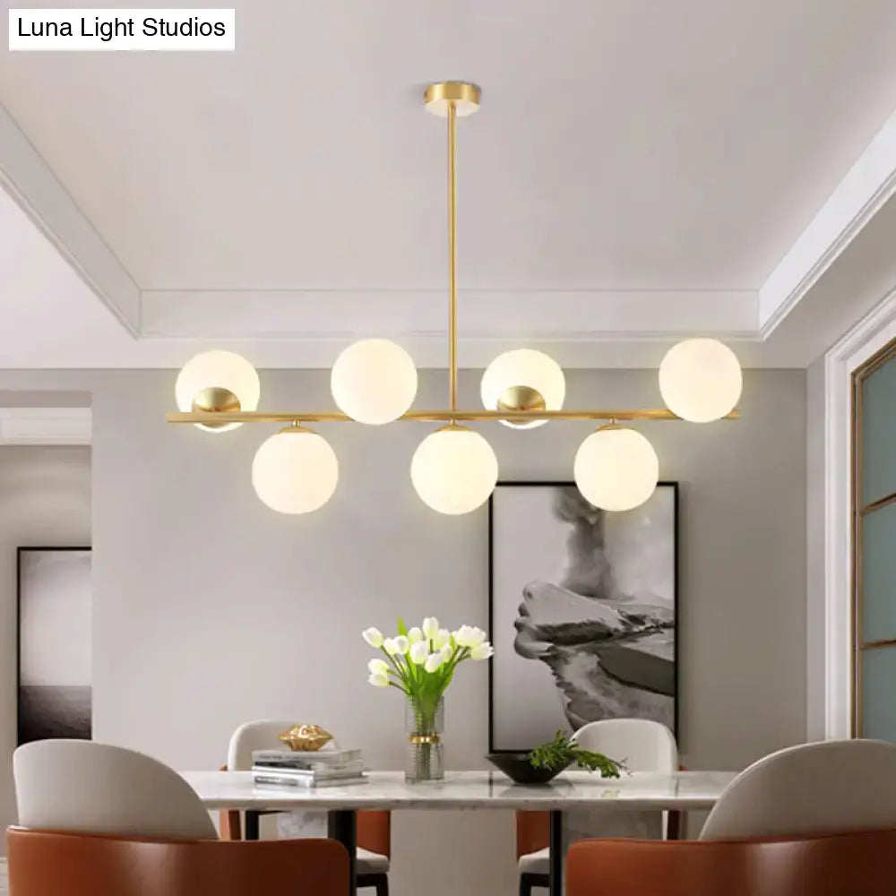 Modern gold spherical island ceiling light with six frosted glass globe shades pendant lighting for dining rooms