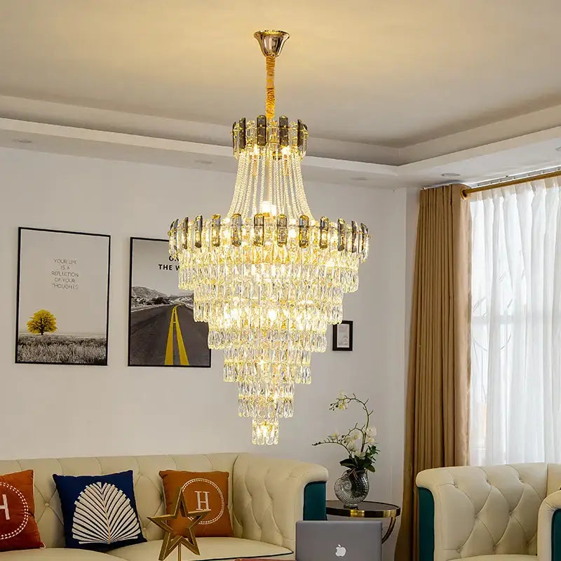 Modern gold spiral decorbites crystal chandelier pendant light with gold frame and cascading clear crystals refracting light