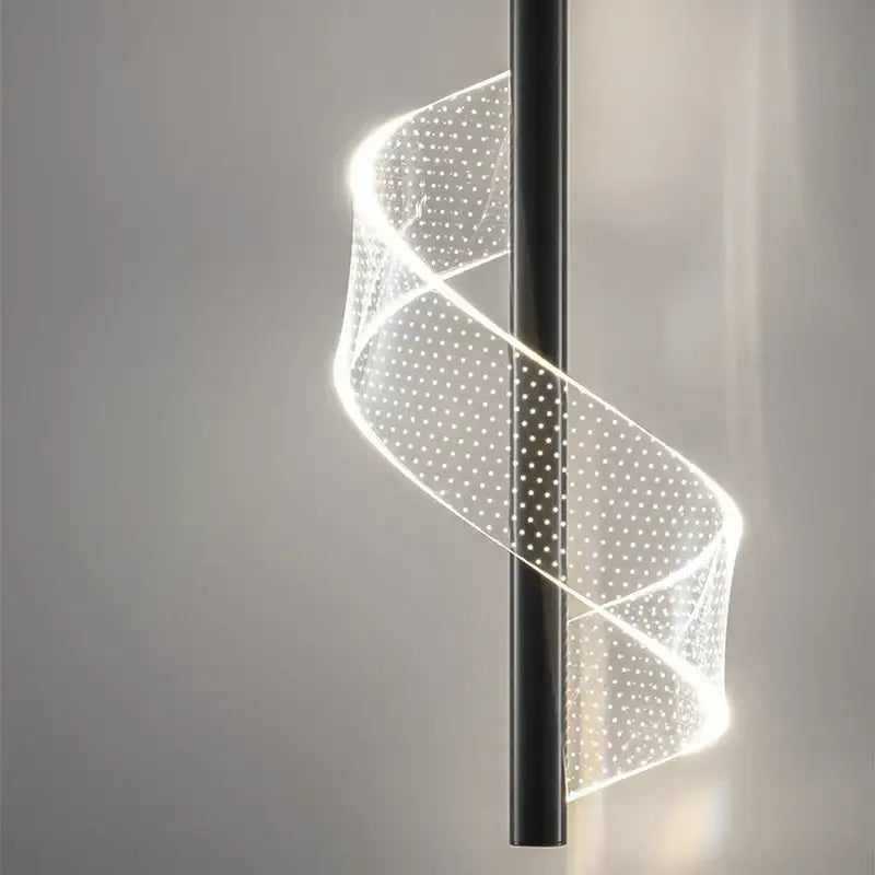 A sleek black aluminum alloy pendant light with a translucent spiraling led light source for dining room use