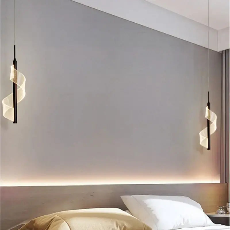 Two sleek black pendant lights with translucent white spiral shades using aluminum alloy light source above bed