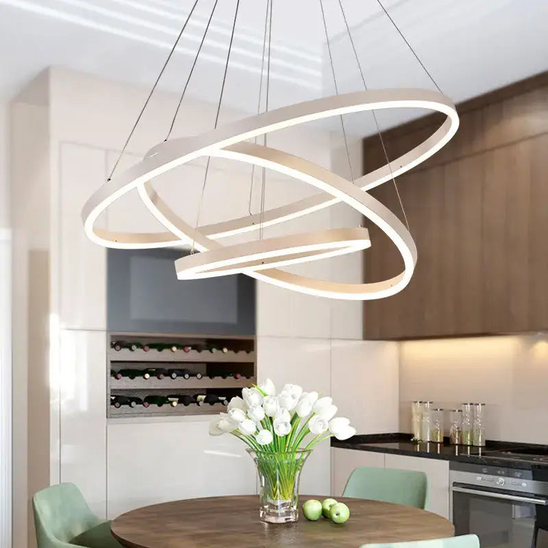 Modern white led pendant light with three interlocking circular rings for dining room decorbites black led rings