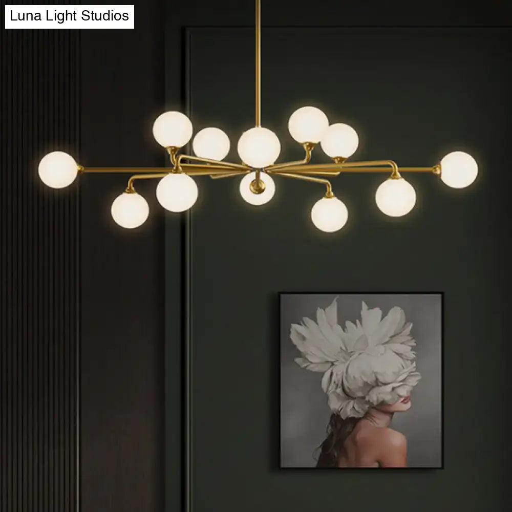 Gold-toned DecorBites™ sputnik pendant lighting with white glass shades modernizes your living room
