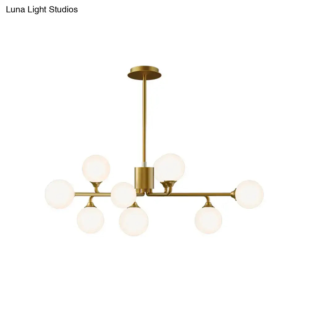 Gold-toned DecorBites™ sputnik pendant lighting with eight white glass shades perfect for modernizing your living room