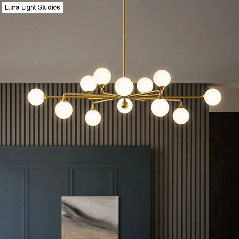 Gold-toned modern DecorBites™ sputnik pendant lighting with white glass shades for living room illumination