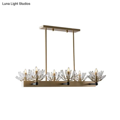 Brass-finished sputnik island light with five crystal flower-like fixtures and exposed bulbs for modern island use