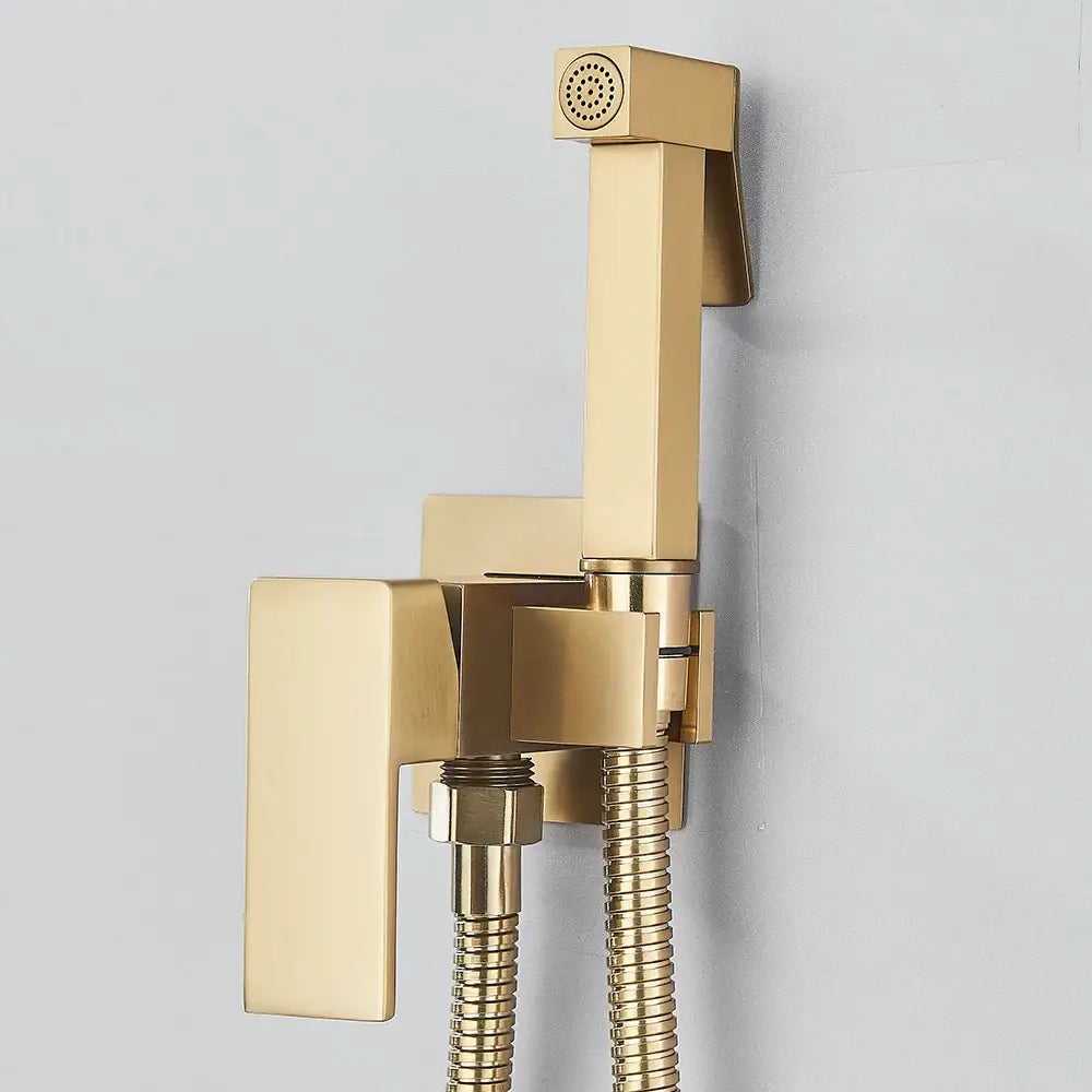 Modern gold bidet shower faucet with sleek metallic finish rectangular sprayer and flexible hose wall mounted