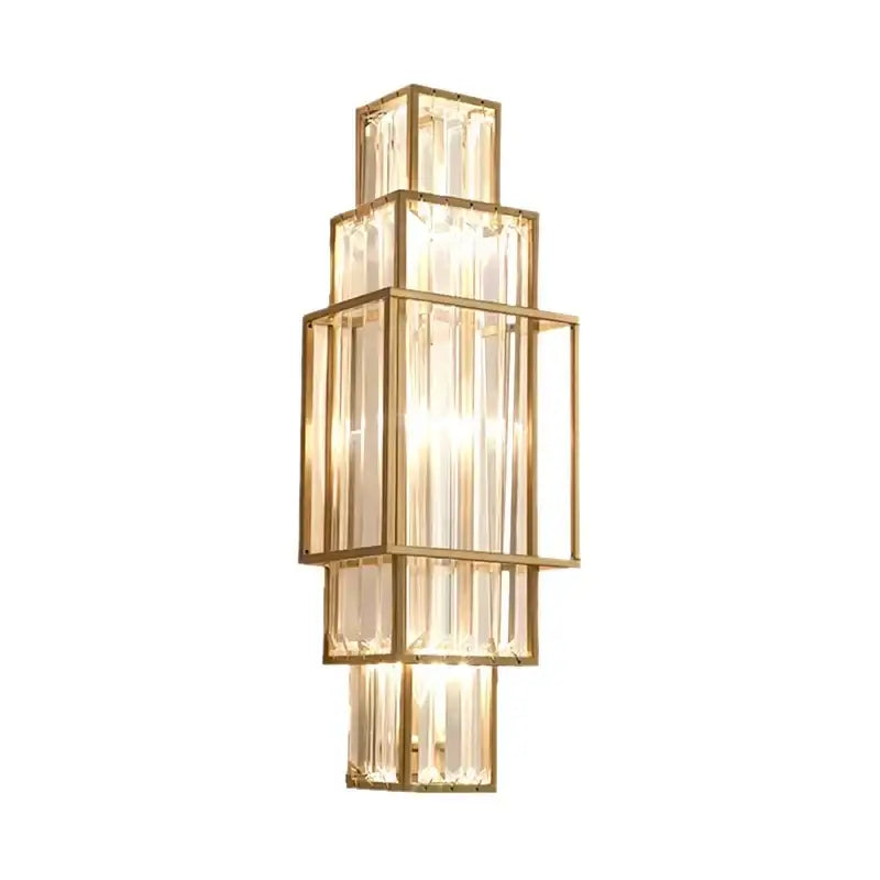 A modern gold wall lamp with stacked rectangular frames and clear faceted glass crystal rods for luxury lighting