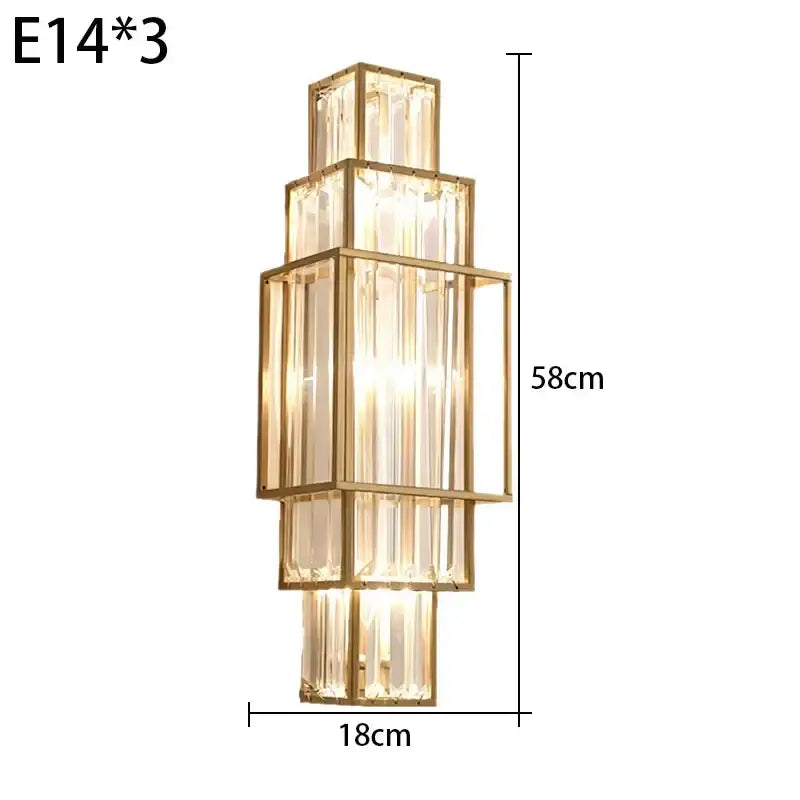 Modern gold wall lamp with stacked rectangular glass crystal panels in a tiered design for luxury bedroom lighting