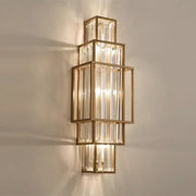 Modern gold stacked crystal wall lamp with rectangular frames and vertical glass crystal rods for luxury bedroom lighting