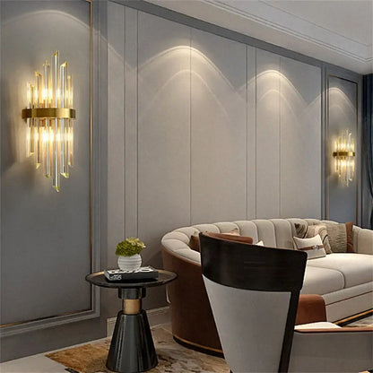 Modern gold stainless steel wall lamp with clear crystal rods and circular brass base for bedroom sconce lighting