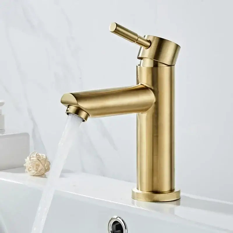 A modern gold stainless steel basin faucet with brushed gold finish and sleek cylindrical single-handle design