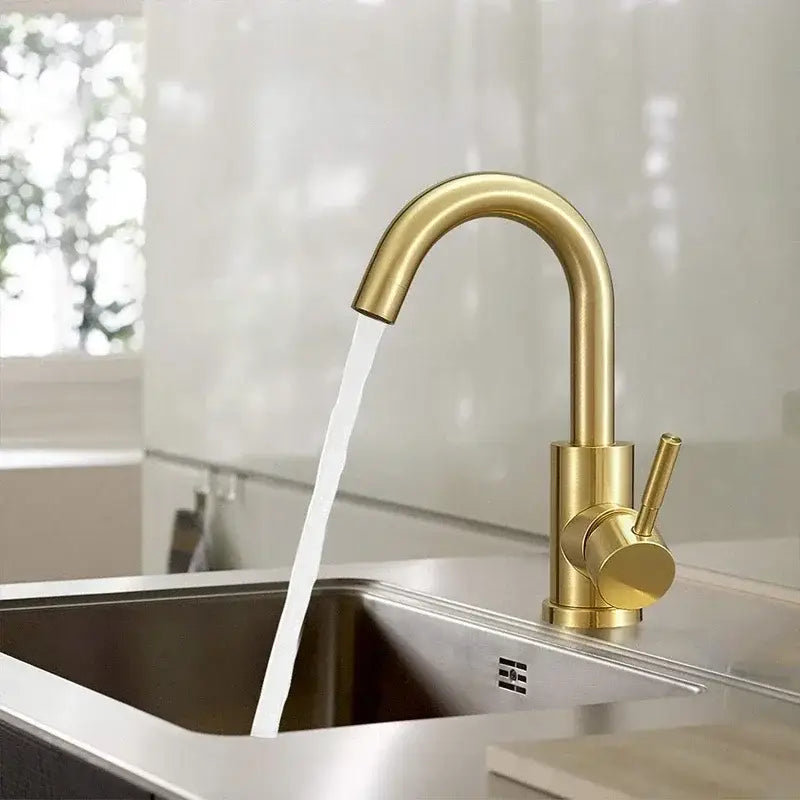 Modern gold stainless steel basin faucet with sleek curved spout and cylindrical handle for bathroom sink decorbites gold stainless