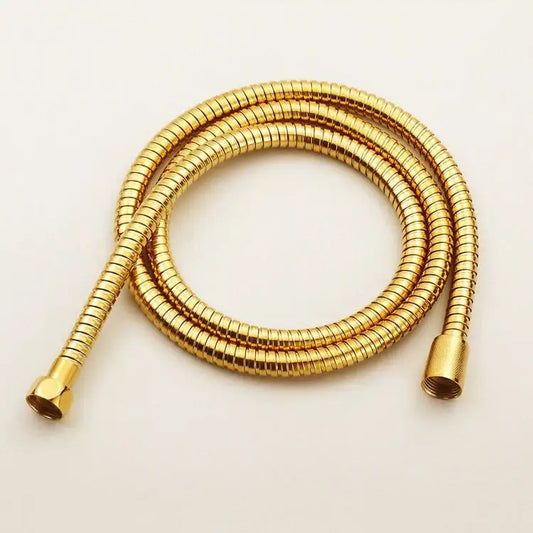 Modern gold stainless steel flexible shower hose with ribbed texture and threaded ends for bathroom replacement by decorbites