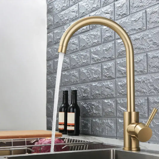 A sleek modern gold stainless steel kitchen faucet with curved spout and single handle for decorbites gold stainless style