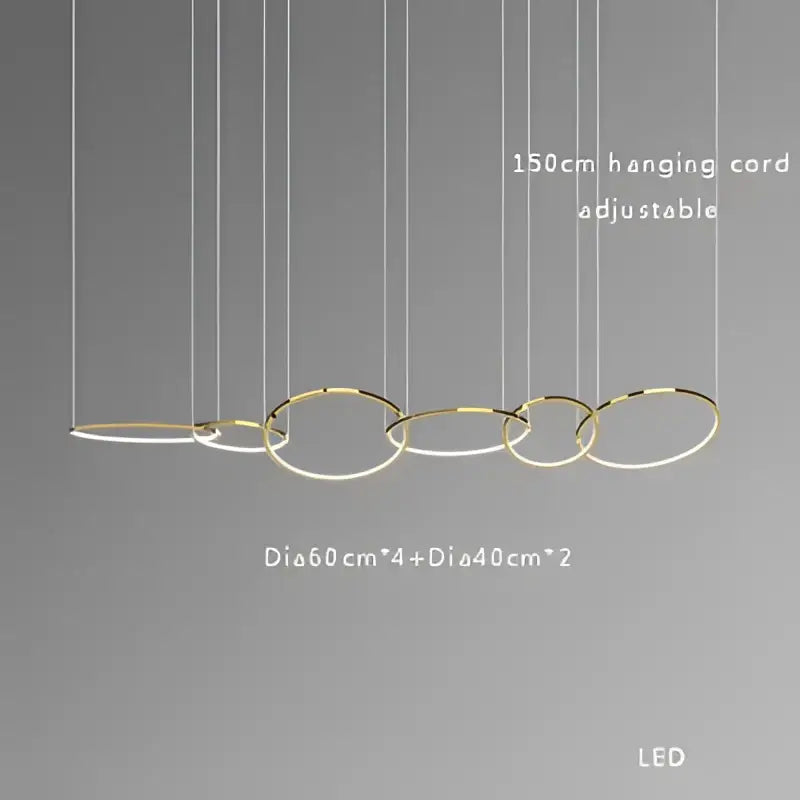 Modern gold stainless steel pendant lamp with interconnected circular rings suspended by adjustable cords decorbites gold stainless