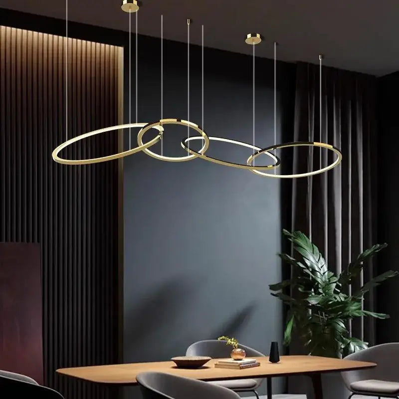 Modern gold stainless steel pendant lamp with sleek interlocking ring design for kitchen decorbites gold stainless style