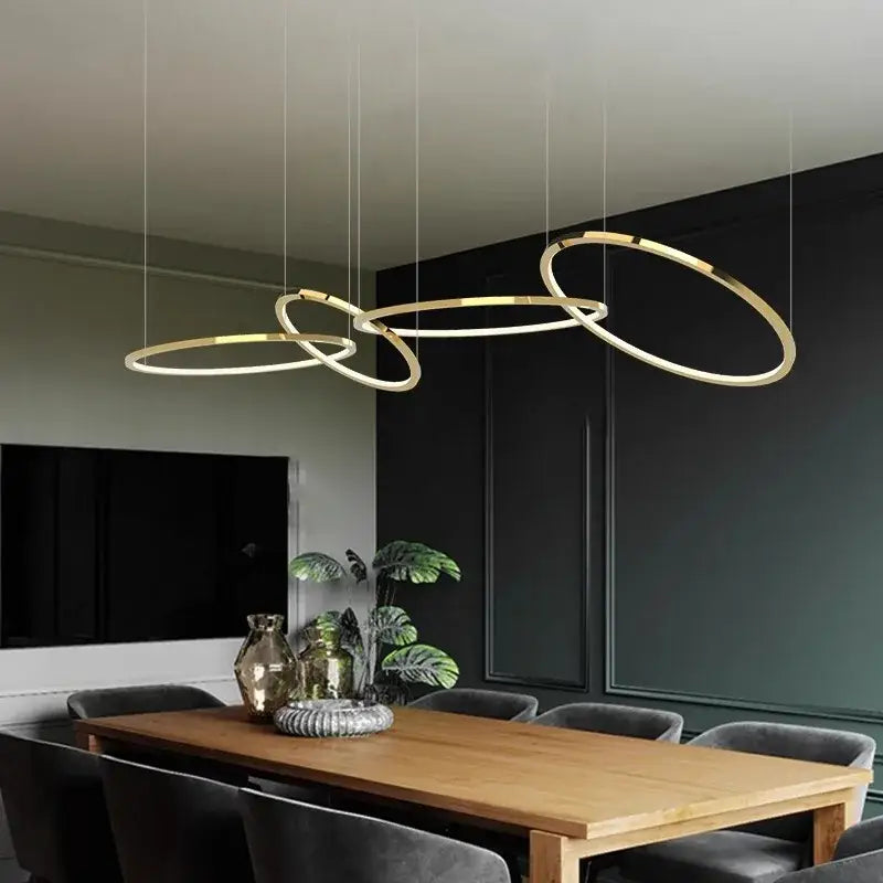 Modern gold stainless steel pendant lamp with sleek interlocking circular rings for kitchen decorbites gold stainless lighting