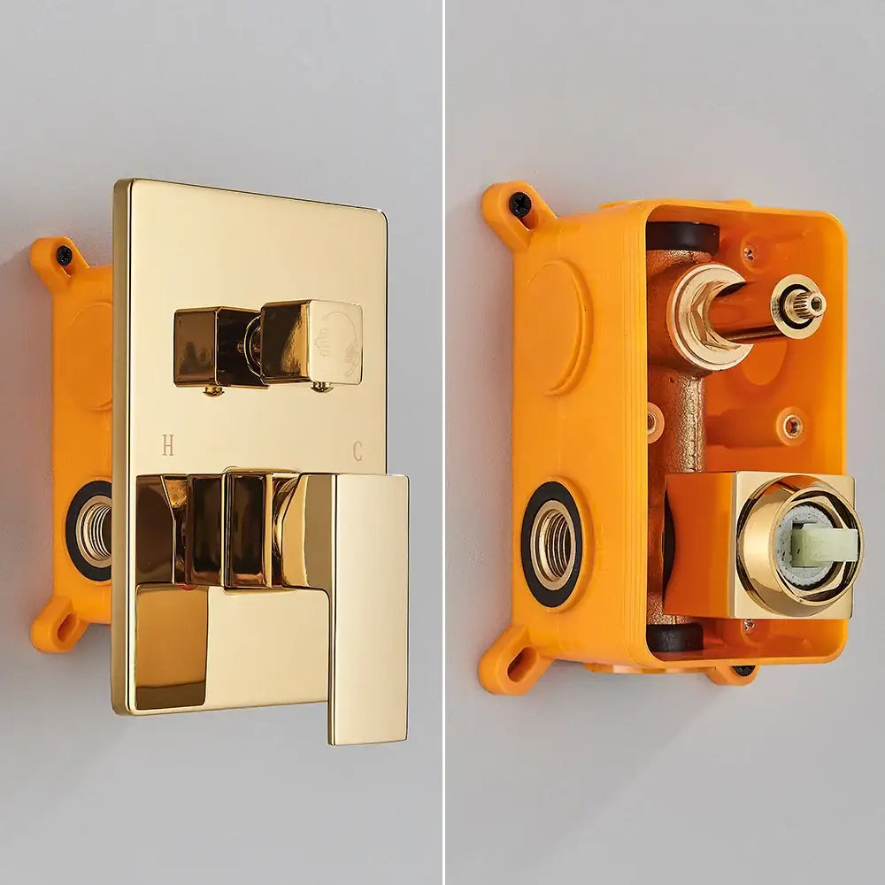 Modern gold stainless steel shower valve with sleek rectangular design and dual control knobs for hot and cold water