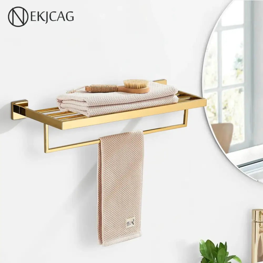 Modern gold stainless steel wall mount towel rack with integrated bathroom shelf and sleek metal design