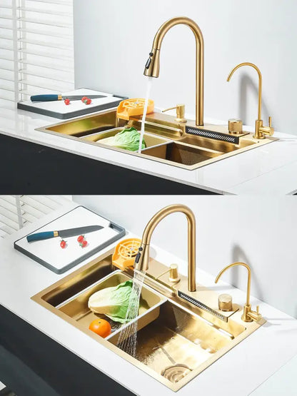 Modern gold stainless steel kitchen sink with dual basins and sleek curved waterfall faucet integrated set