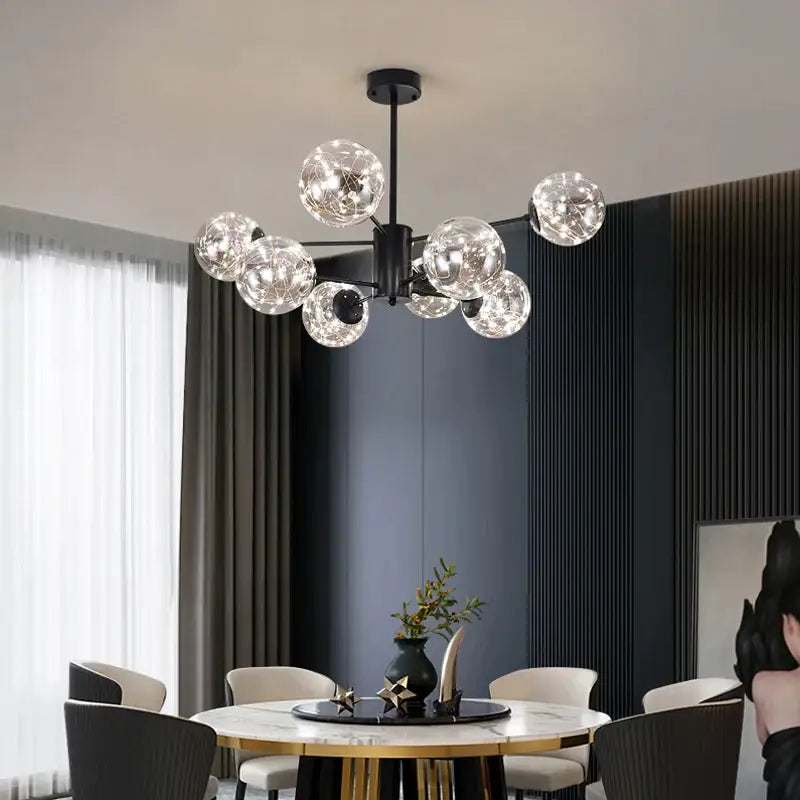 Black metal chandelier pendant light with multiple clear glass globe bulbs for modern gold star glass dining decorbites gold star