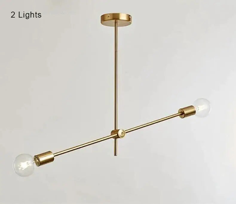 Modern gold starburst pendant light with brass finish and two exposed bulb fixtures for dining room decorbites glass ball globe