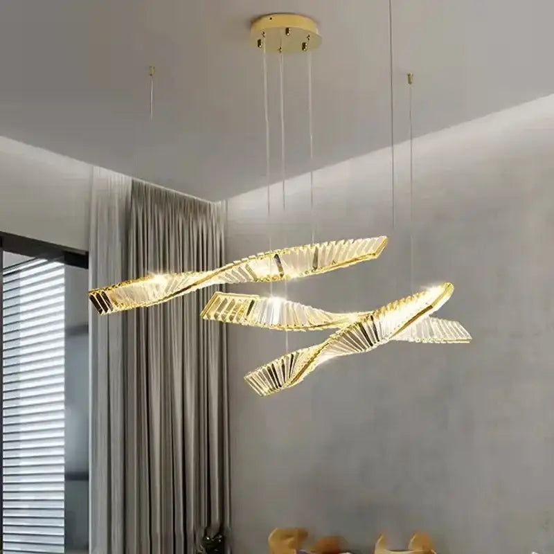 Modern gold steel led pendant light with sleek twisted design and clear crystal panels for dining room decorbites gold steel chandelier