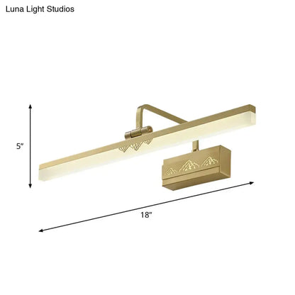 Modern gold swing arm wall sconce with a sleek tube metallic wall design and mountain silhouette etched base for bedroom use