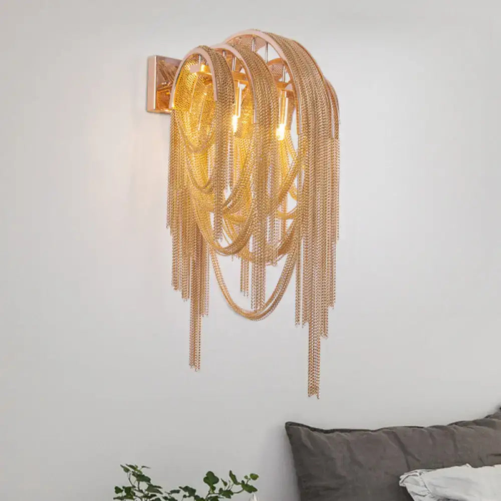 Modern gold tassel wall sconce with cascading chain links and rectangular backplate for 110v-120v fixture height and width