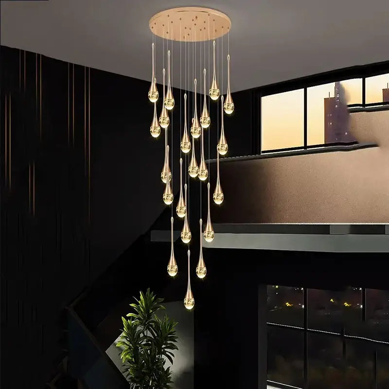 Modern gold teardrop crystal pendant light with multiple glass pendants for dining room ceiling lighting