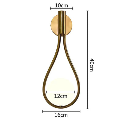 A modern gold brass teardrop glass ball pendant light with illuminated glass panel for kitchen decorbites decor